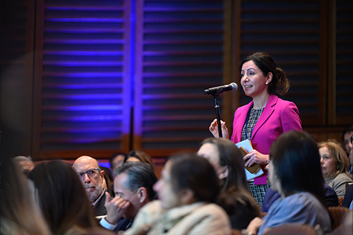 attendee at a microphone asking a question