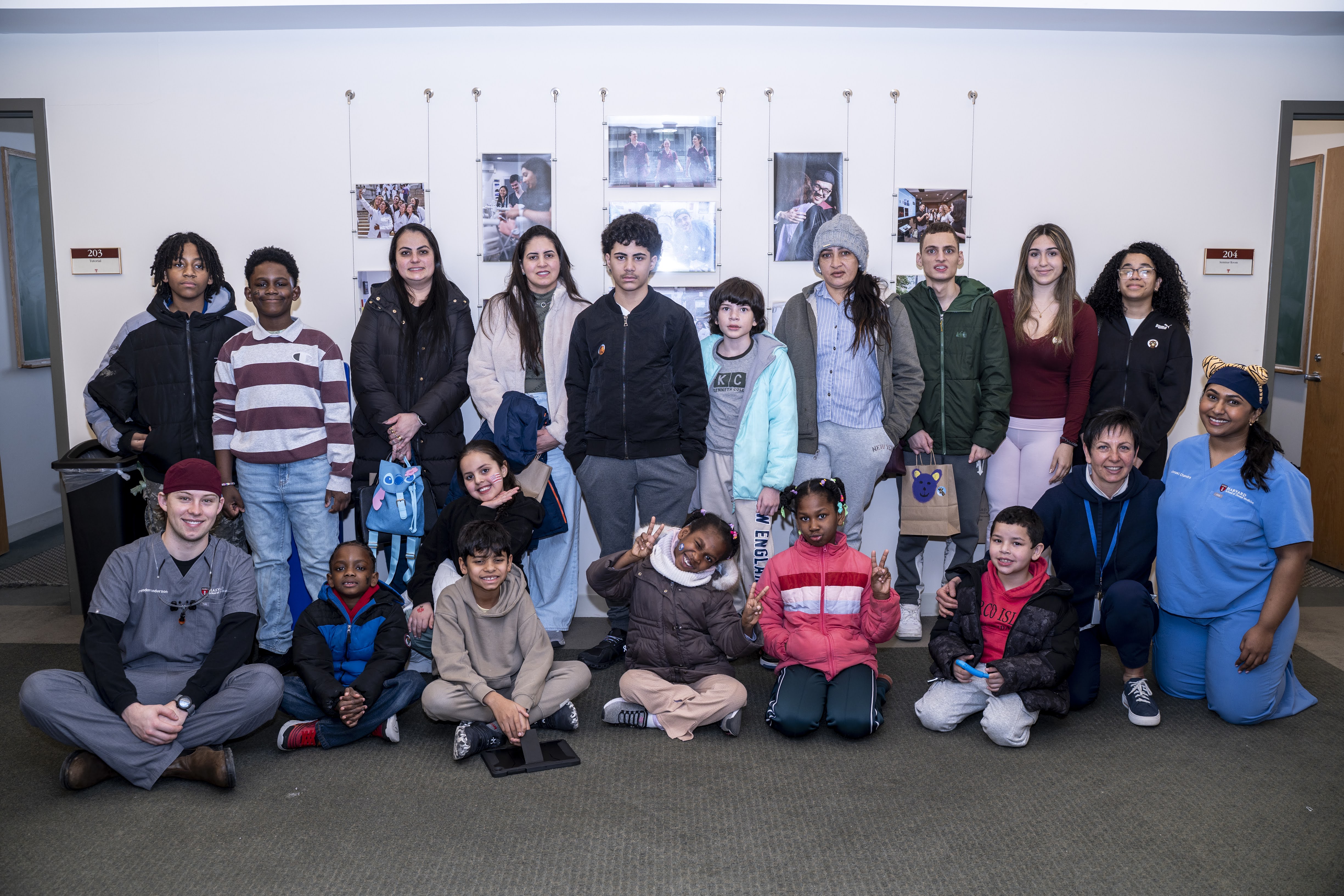 Group of students and childeren pose for a group photo
