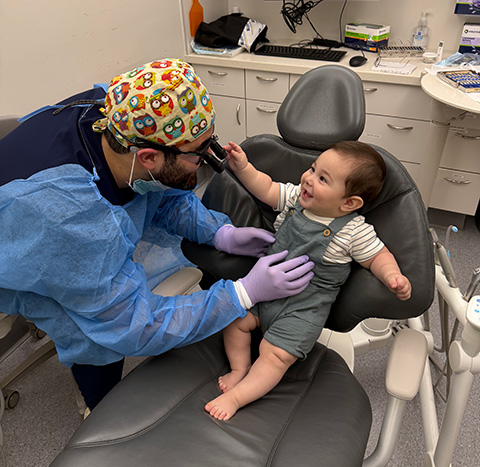 clinician working on a infant patient