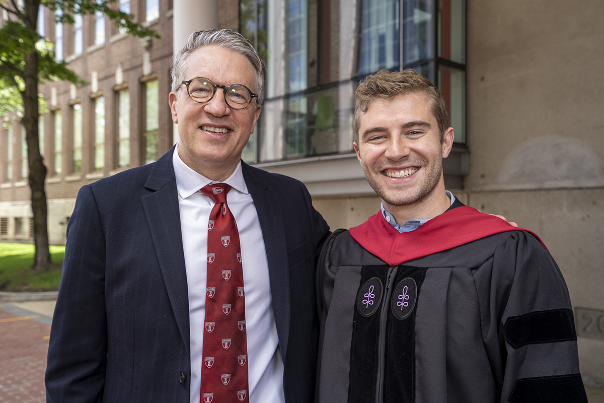Dean Giannobile and Alex Cruz, DMD21, pose together on Class Day.