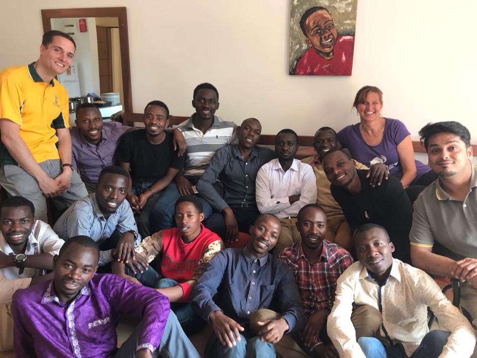 Brennan Arden, DMSc21, visits with patients in Rwanda.