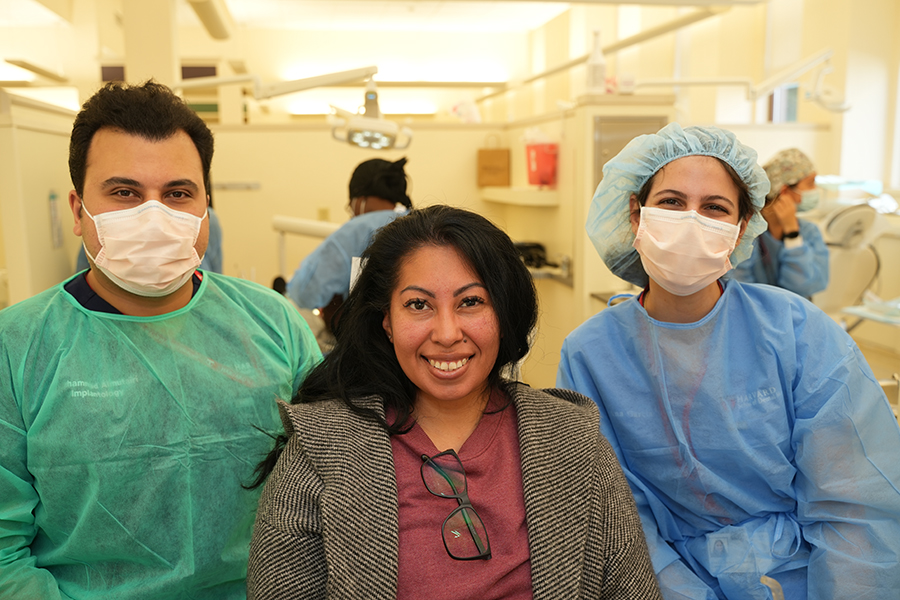 female veteran with student dentists