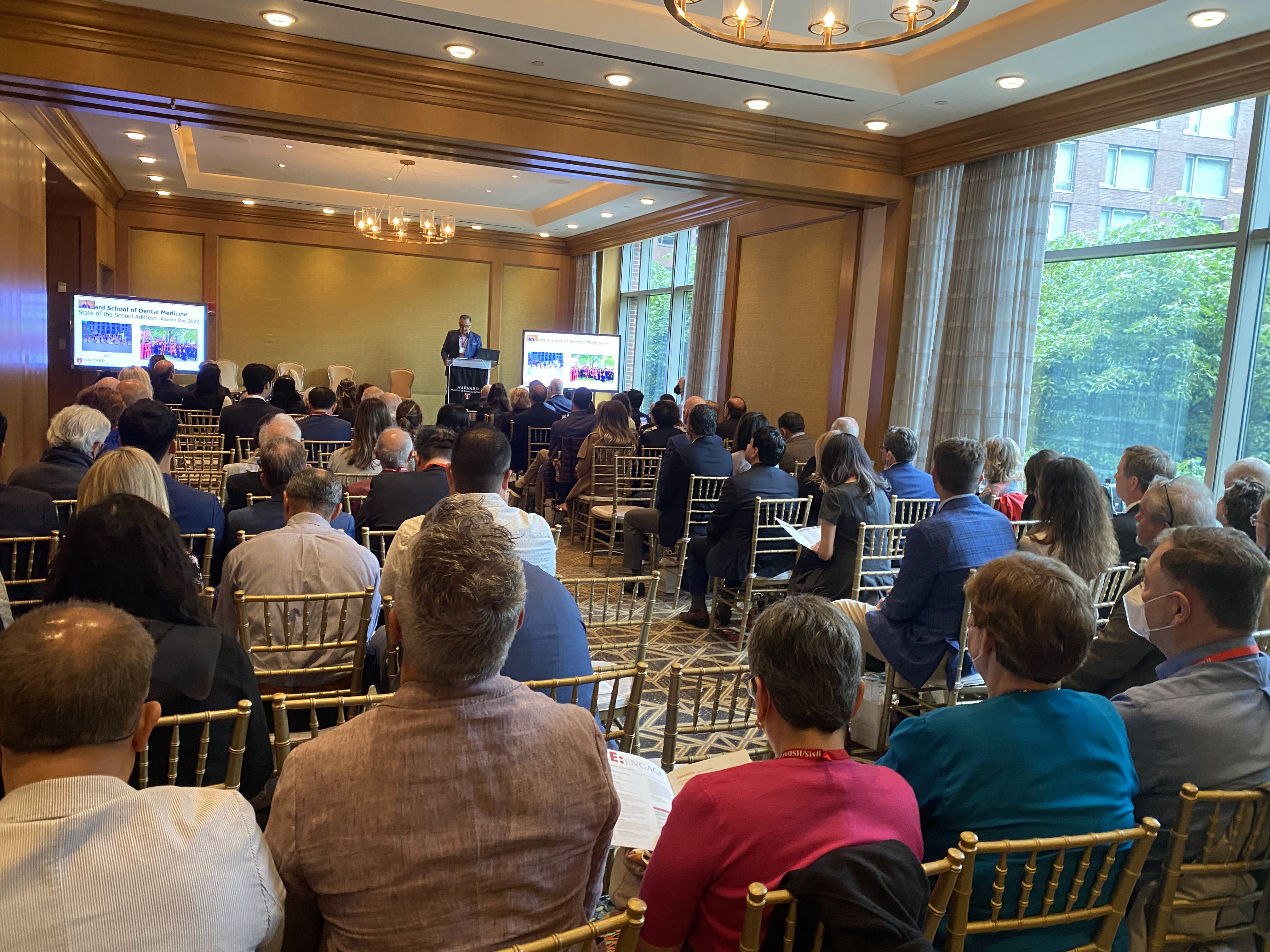 Audience looking at speaker on stage at podium