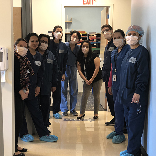 Laura Lin, DMD21, providing patient care with her classmates at the ACTION clinic.
