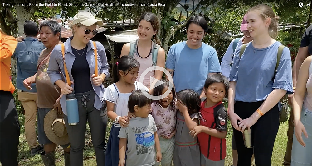 video screen with students in Costa Rica