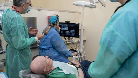 Dentists working with a patient in the clinic