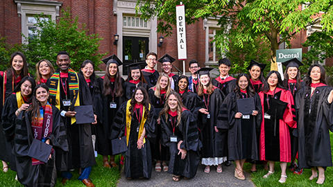 Students in cap and gowns in Harvard Yard