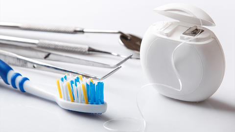 toothbrush, floss, and dental tools