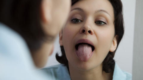 Person sticking out their tongue