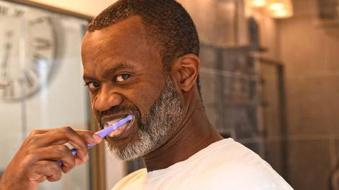 A person brushing teeth 