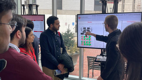 student presenting to attendees