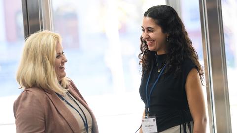 two women conversing