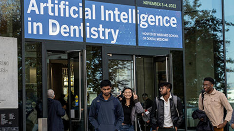 Participants walking out of the front entrance of Harvard’s Science & Engineering Complex.