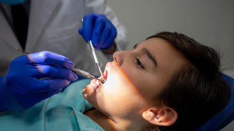 a young boy receiving dental care