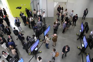 People presenting in a large space