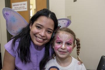 Two people with paint on their face