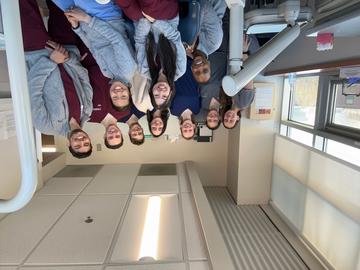 Group of students standing together in a dental clinic