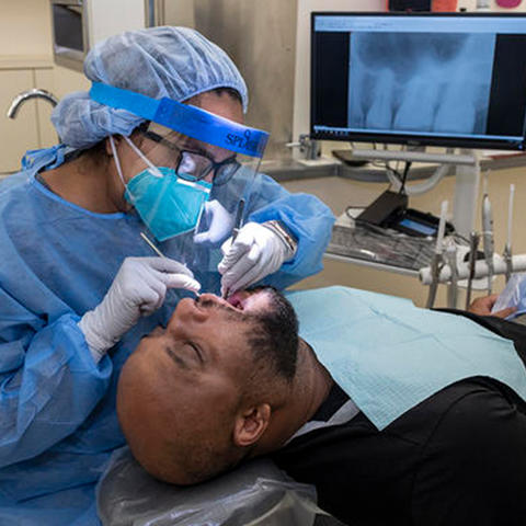 clinician working on a paient