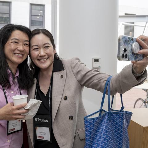 Two people standing together taking a selfie