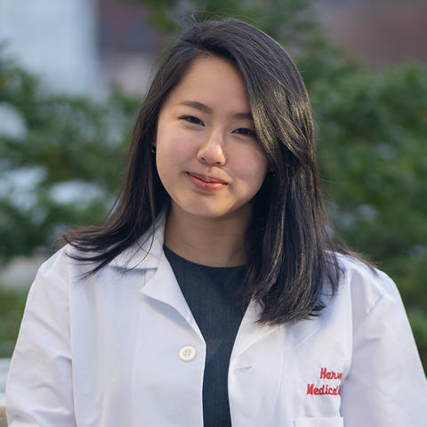 Student wearing white coat