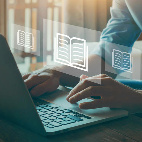 Close up of hands on a laptop