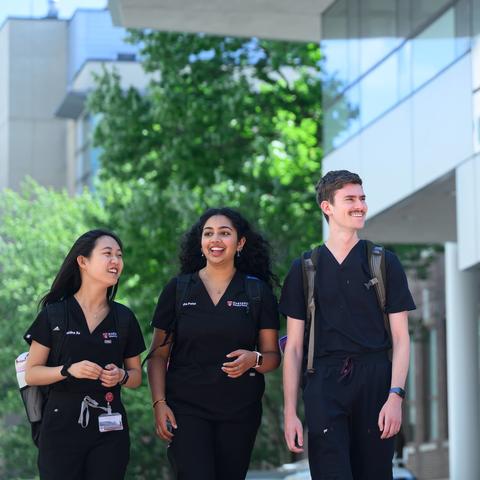 students walking outside the REB
