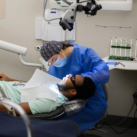 clinician working on a patient