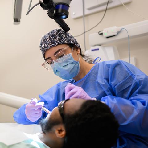 clinician working on a patient