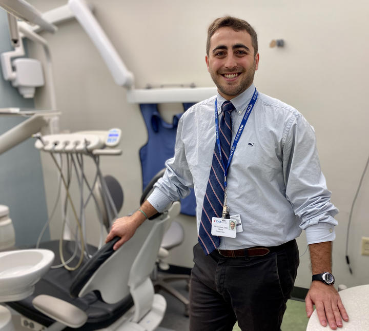 Alec Eidelman, PD19, standing in a dental operatory