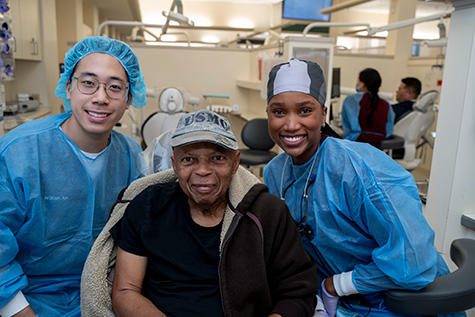 two students with a vet at the GVAS event 