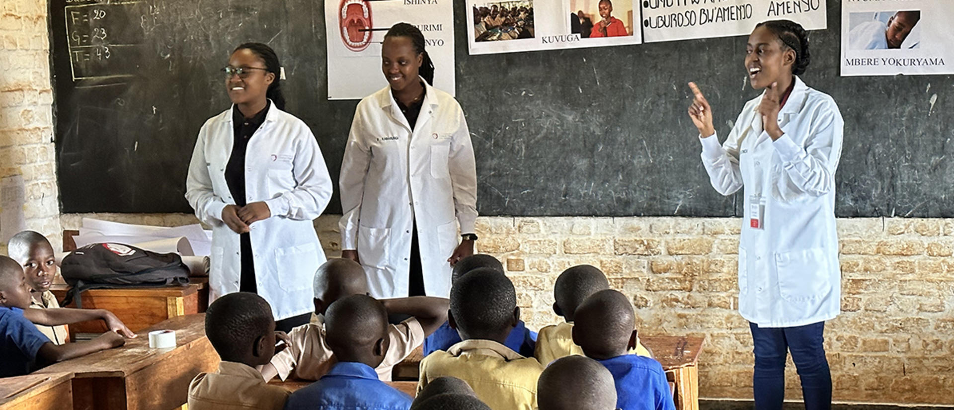 Dentists teaching in Rwanda classroom