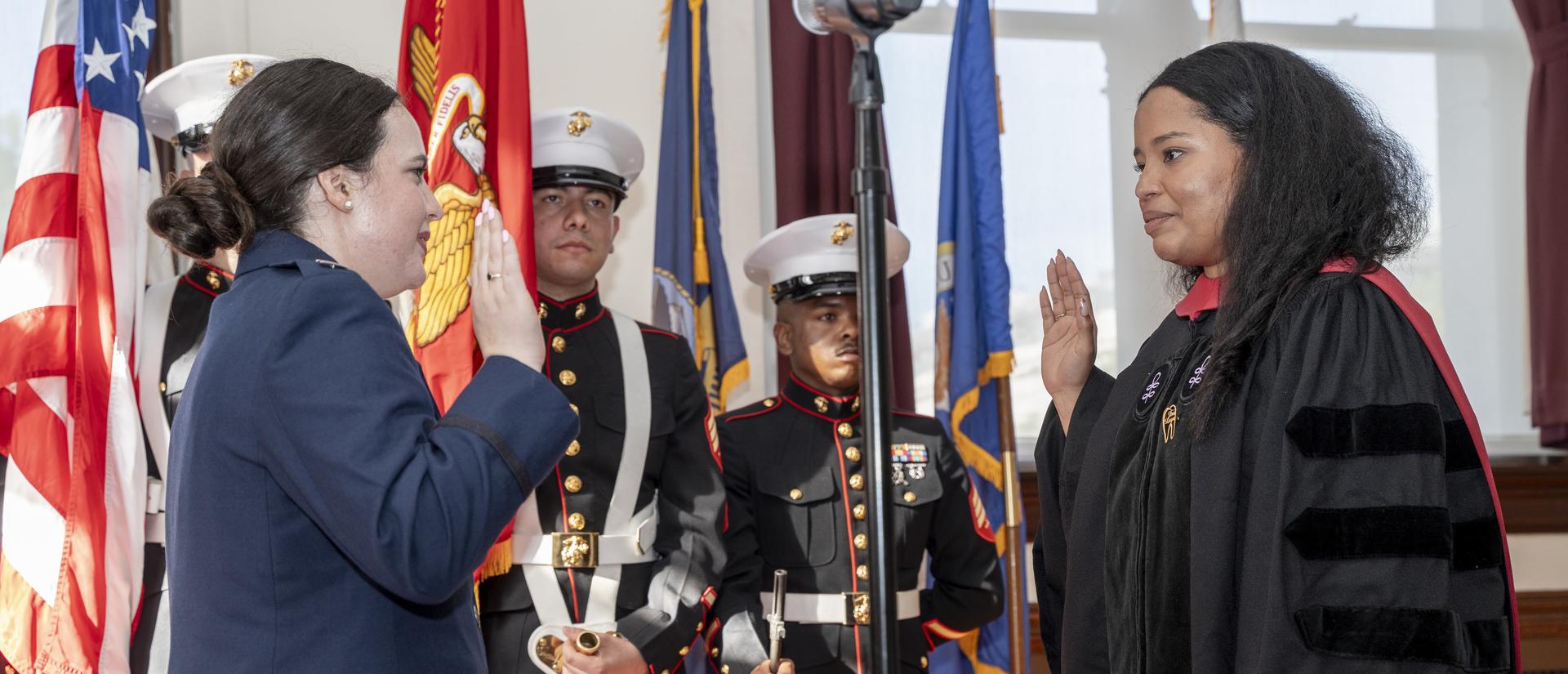 Person wearing gowns at military service