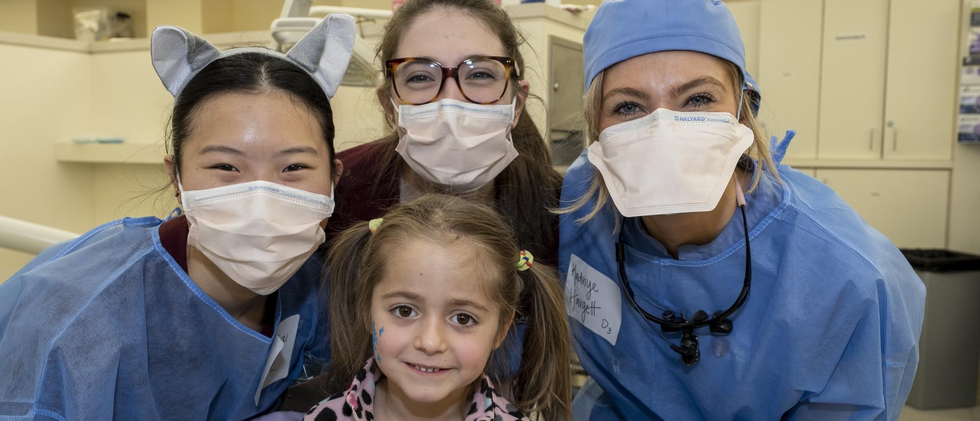 dental students with child patient