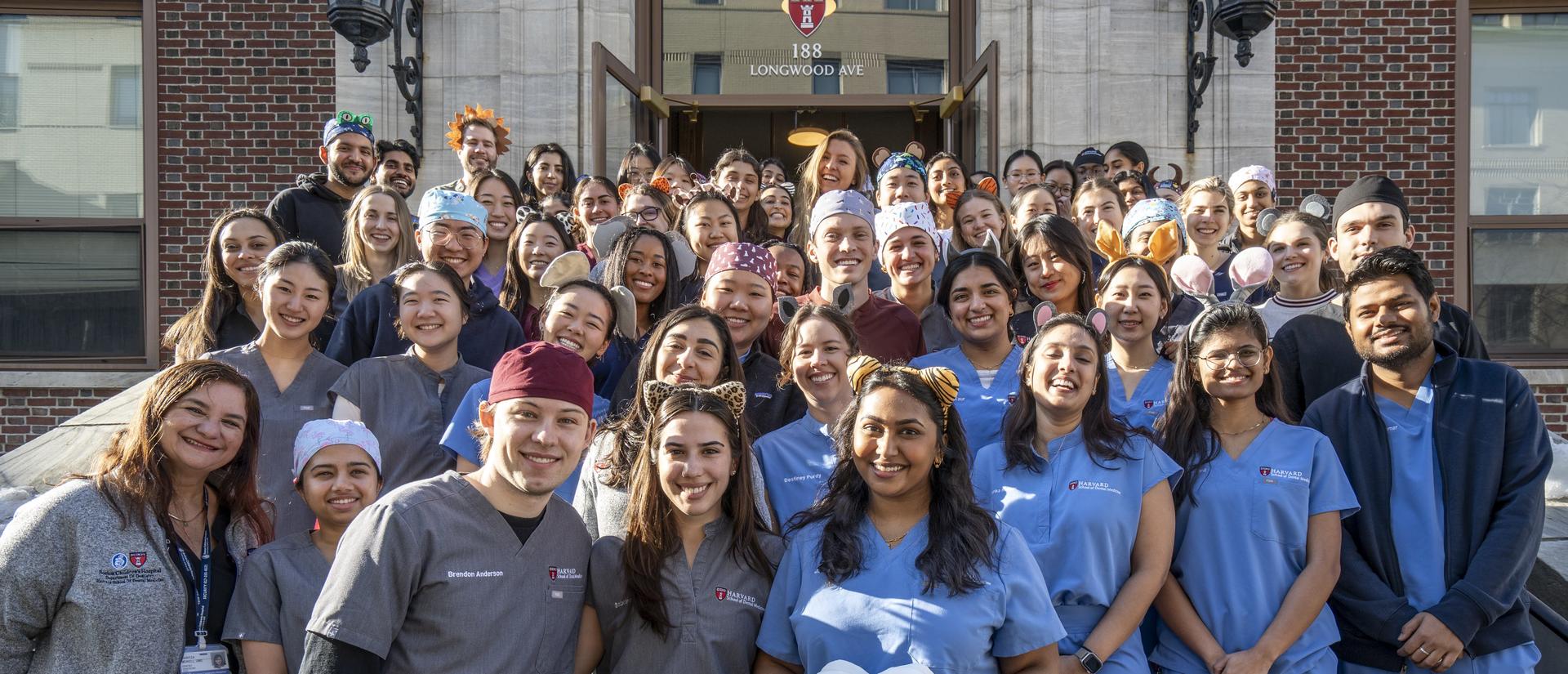 Dental students standing on front steps taking group photo