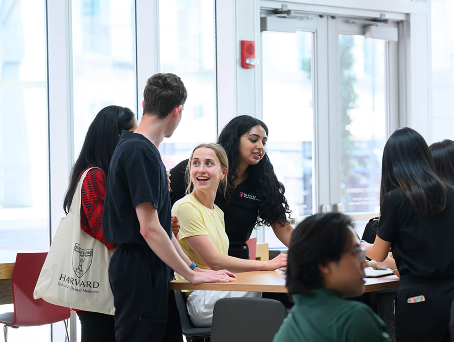 Students socializing in the REB lobby