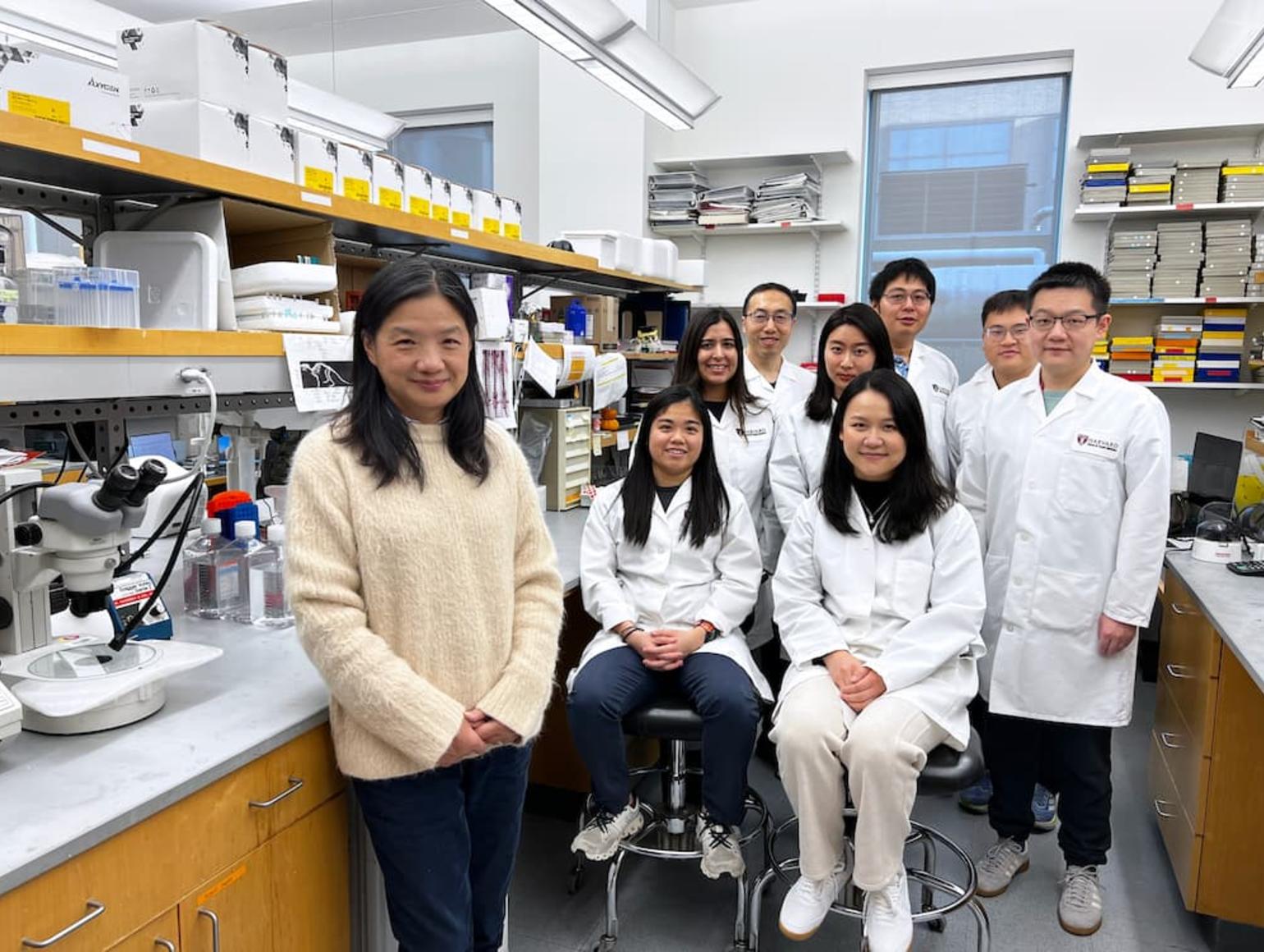 Yang lab team in front of lab bench