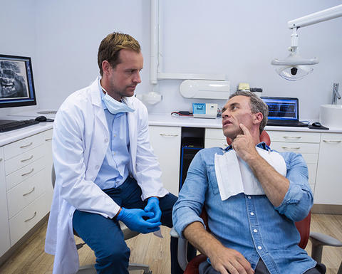 dentist talking with a patient