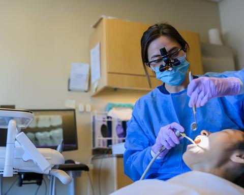 dentist performing an oral exam
