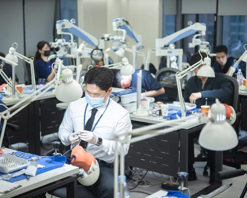 students working on models in a lab